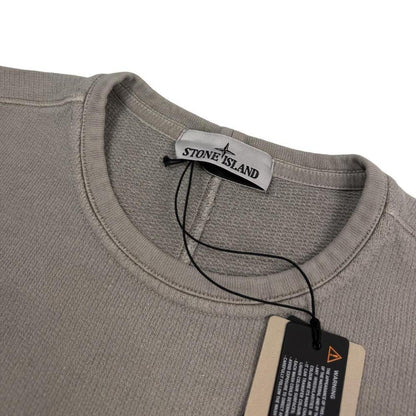 Stone Island khaki brown sweatshirt with logo patch and closed loop design.