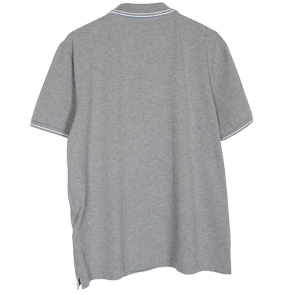 Stone Island grey polo shirt with embroidered compass logo and cotton material.