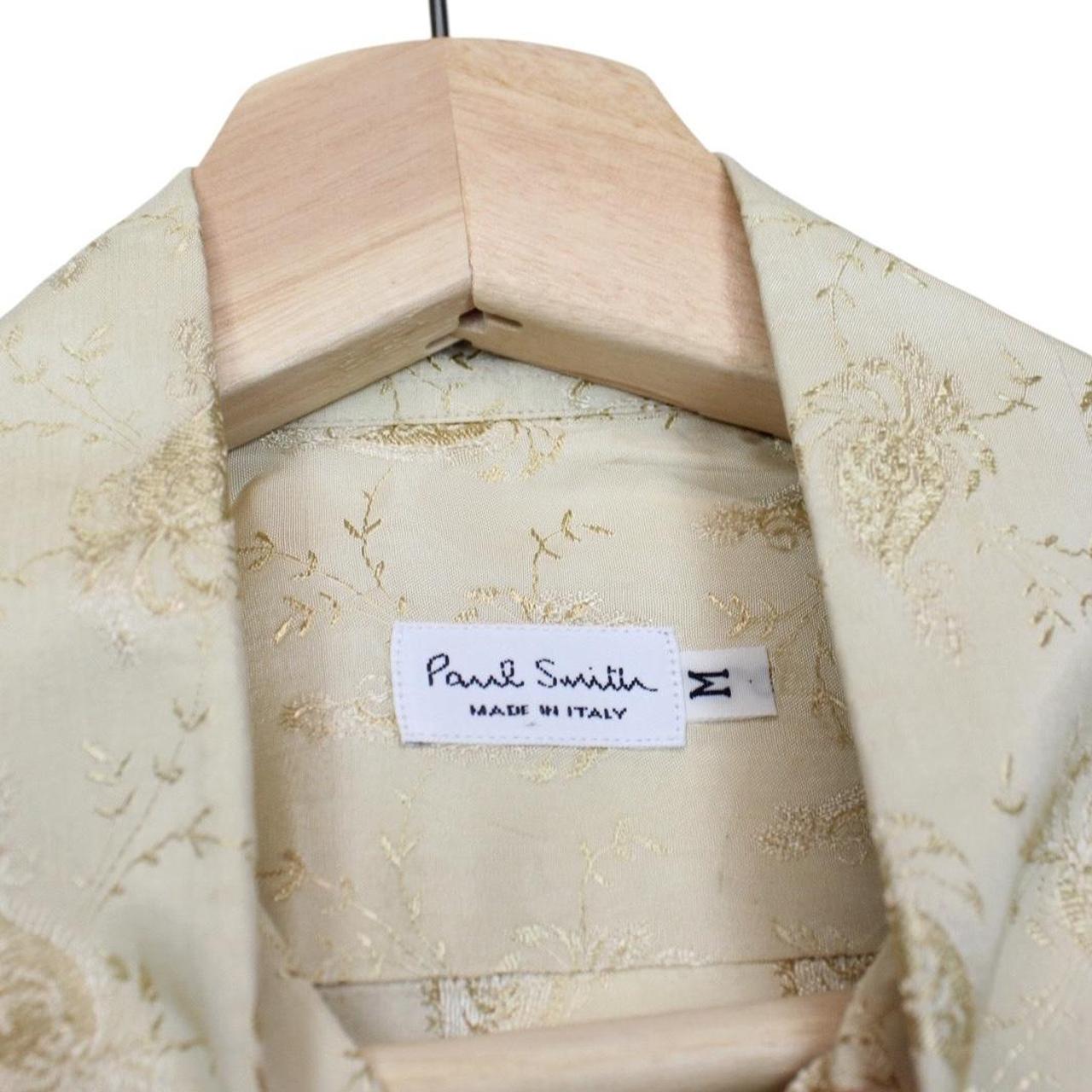 Paul Smith beige long sleeve silk shirt with subtle logo detail and smooth texture.