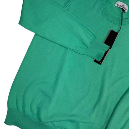 Stone Island green knit jumper made from organic cotton with logo patch detail.