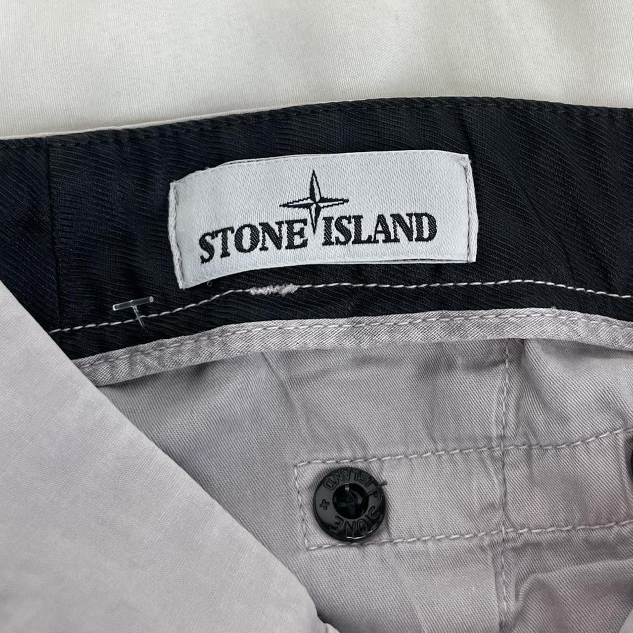 Stone Island grey cargo trousers with logo patch and slim fit design.