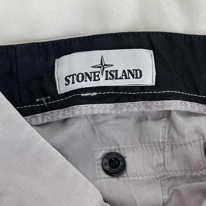 Stone Island grey cargo trousers with logo patch and slim fit design.