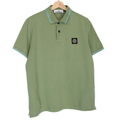 Stone Island green polo shirt with embroidered compass logo and cotton material.