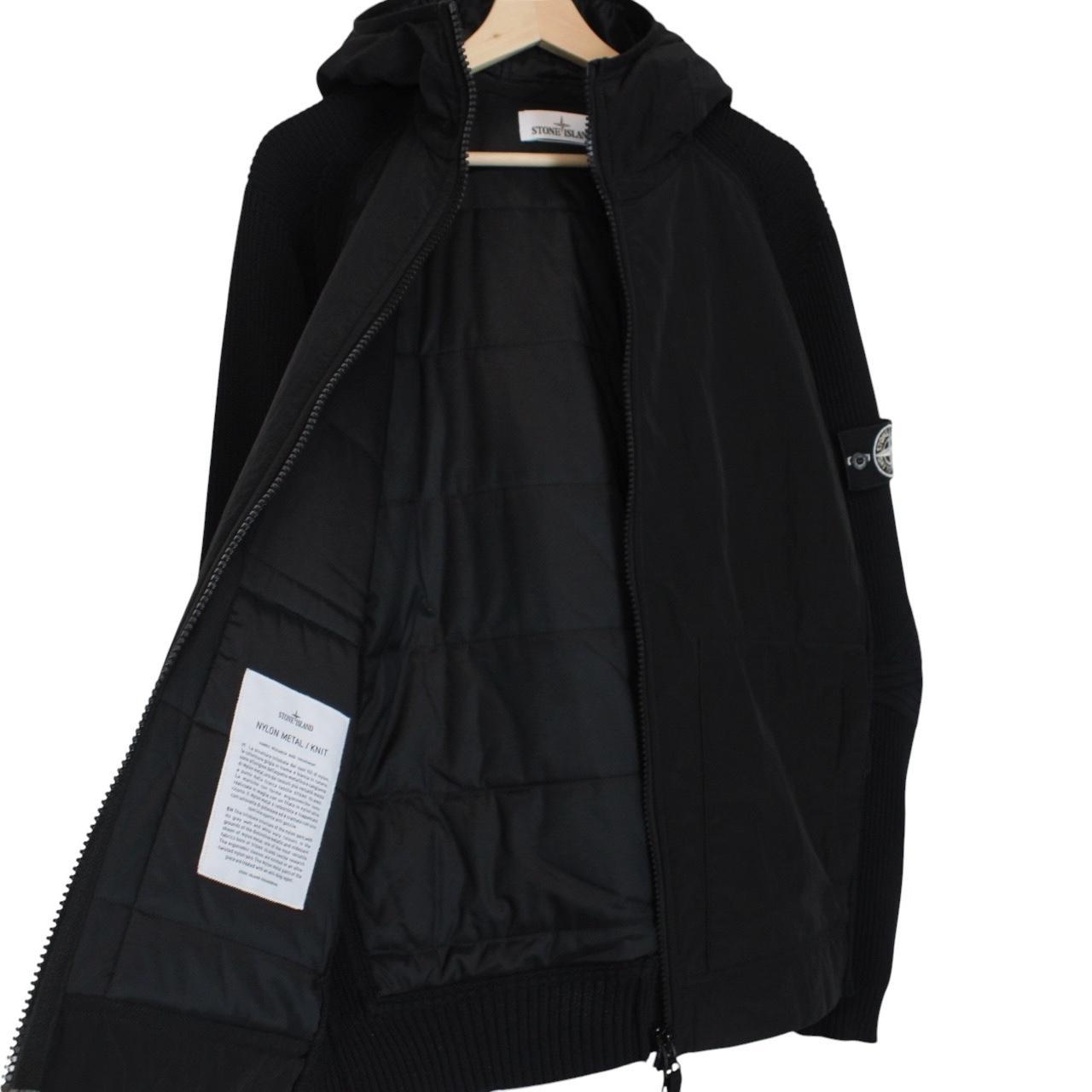 Stone Island black jacket with special process badge and full zip design.