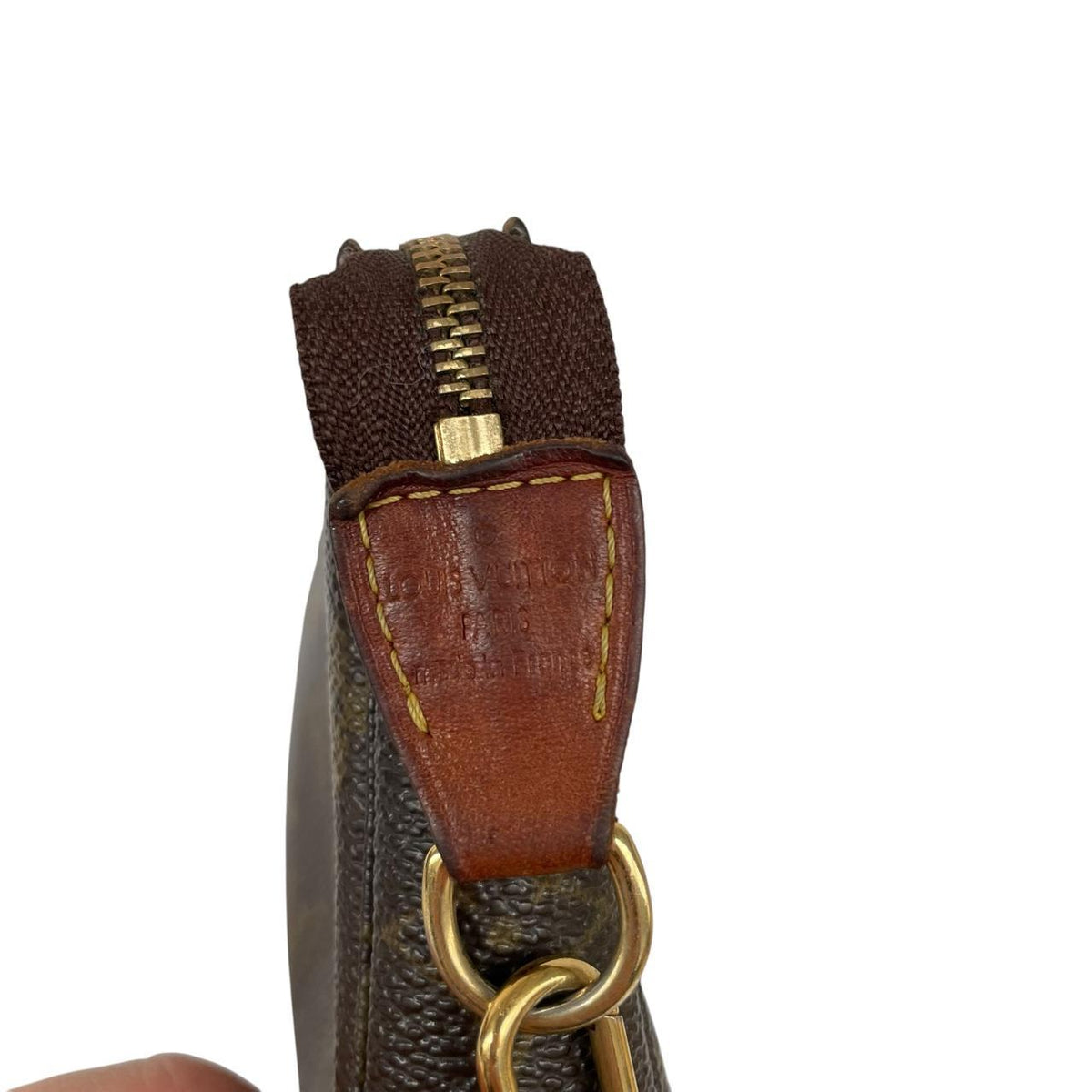 Louis Vuitton brown messenger bag with monogram pattern and gold-tone hardware.