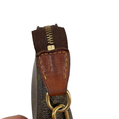 Louis Vuitton brown messenger bag with monogram pattern and gold-tone hardware.