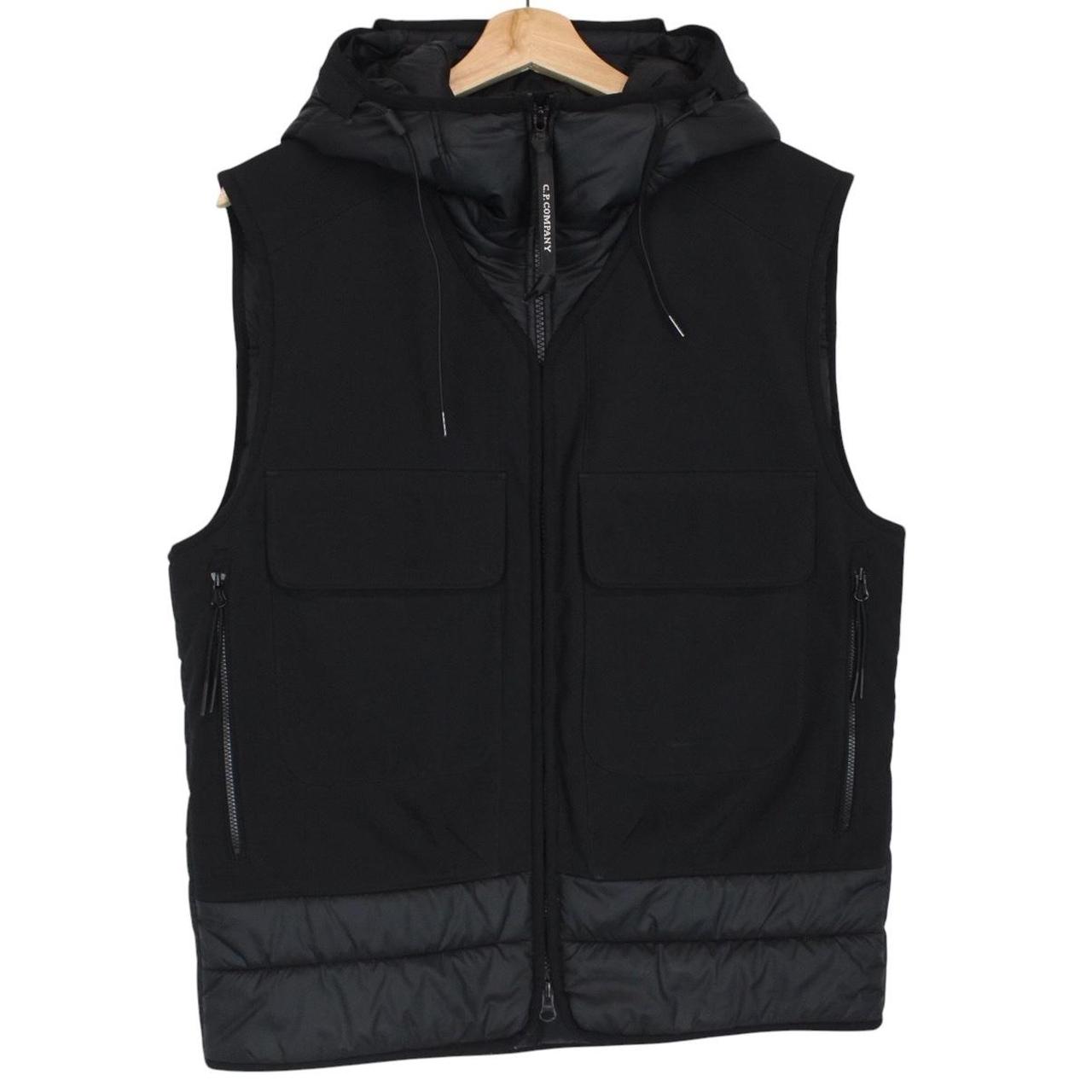 CP Company black goggle gilet with logo detail and shell material.