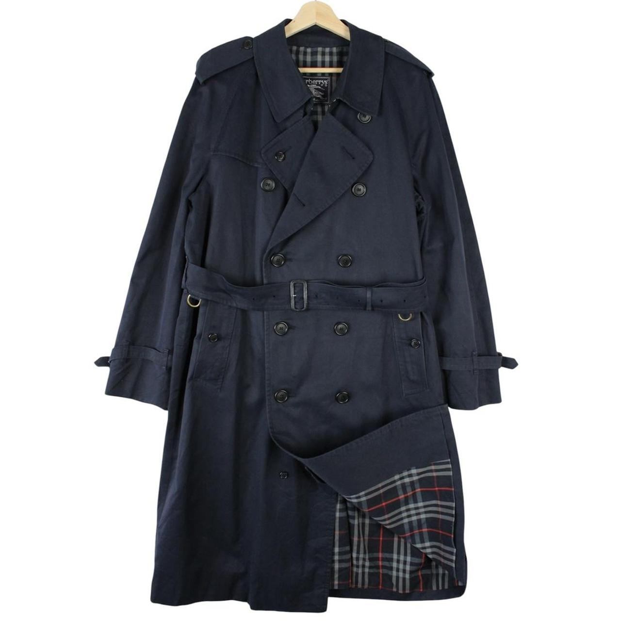 Burberry navy blue belted double breasted trench coat with classic check lining.