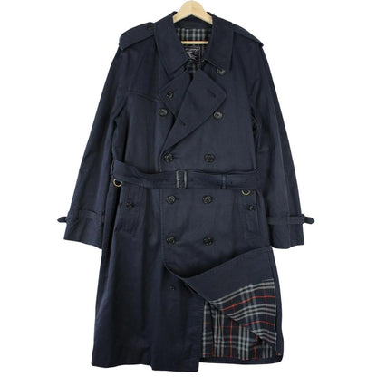 Burberry navy blue belted double breasted trench coat with classic check lining.