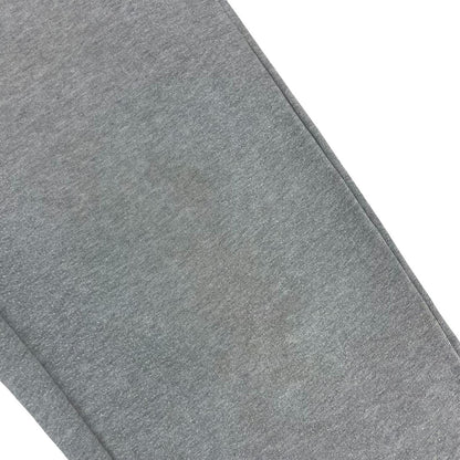 Stone Island grey tracksuit bottoms cotton material with logo patch and faint marks.