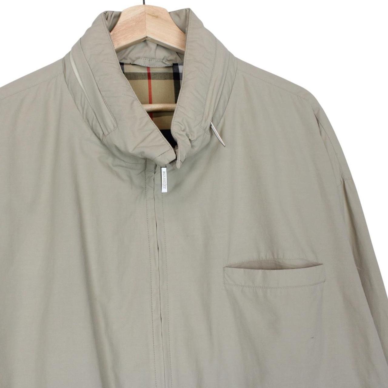 Burberry beige nylon jacket with Nova Check lining and full zip design.