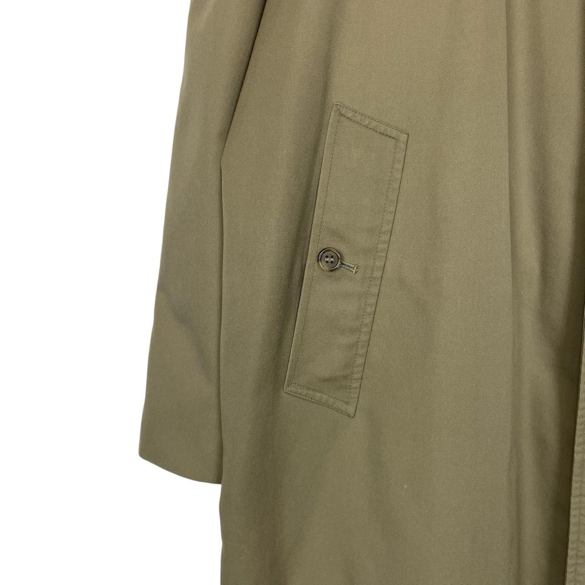 Burberry khaki green trench coat featuring classic Nova Check pattern and single breasted design.