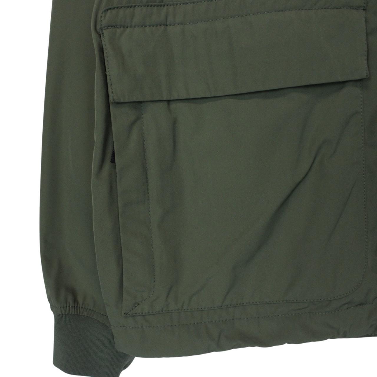 Stone Island green full zip jacket with packable hood and removable brand patch.
