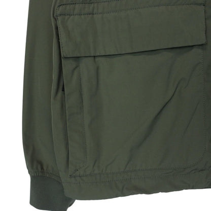 Stone Island green full zip jacket with packable hood and removable brand patch.