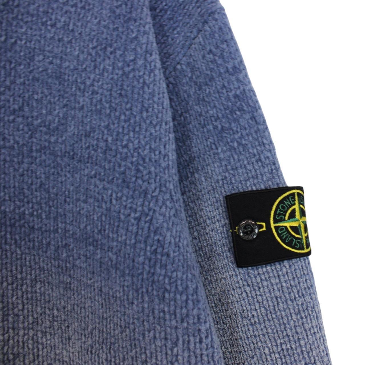 Stone Island blue jumper with degrade knit pattern and logo badge on sleeve.