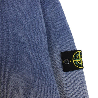 Stone Island blue jumper with degrade knit pattern and logo badge on sleeve.