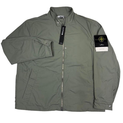 Stone Island green full zip jacket with logo patch and micro twill fabric.
