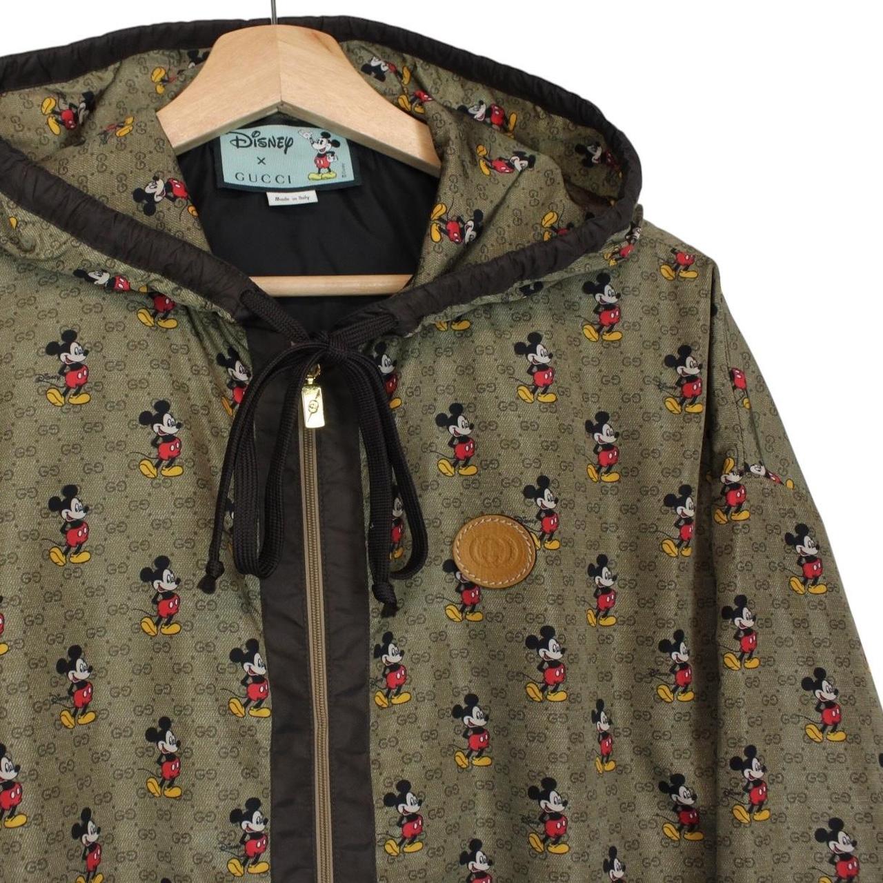 Gucci x Disney khaki brown windbreaker jacket with monogram pattern and nylon material.