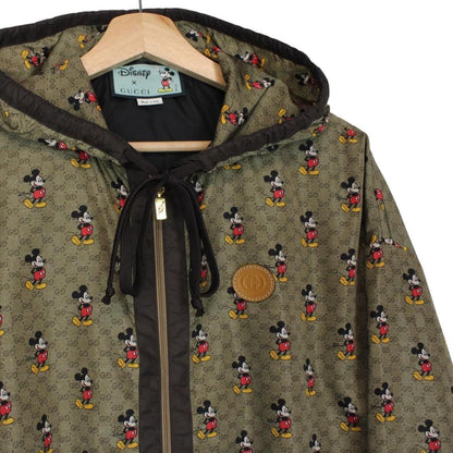 Gucci x Disney khaki brown windbreaker jacket with monogram pattern and nylon material.