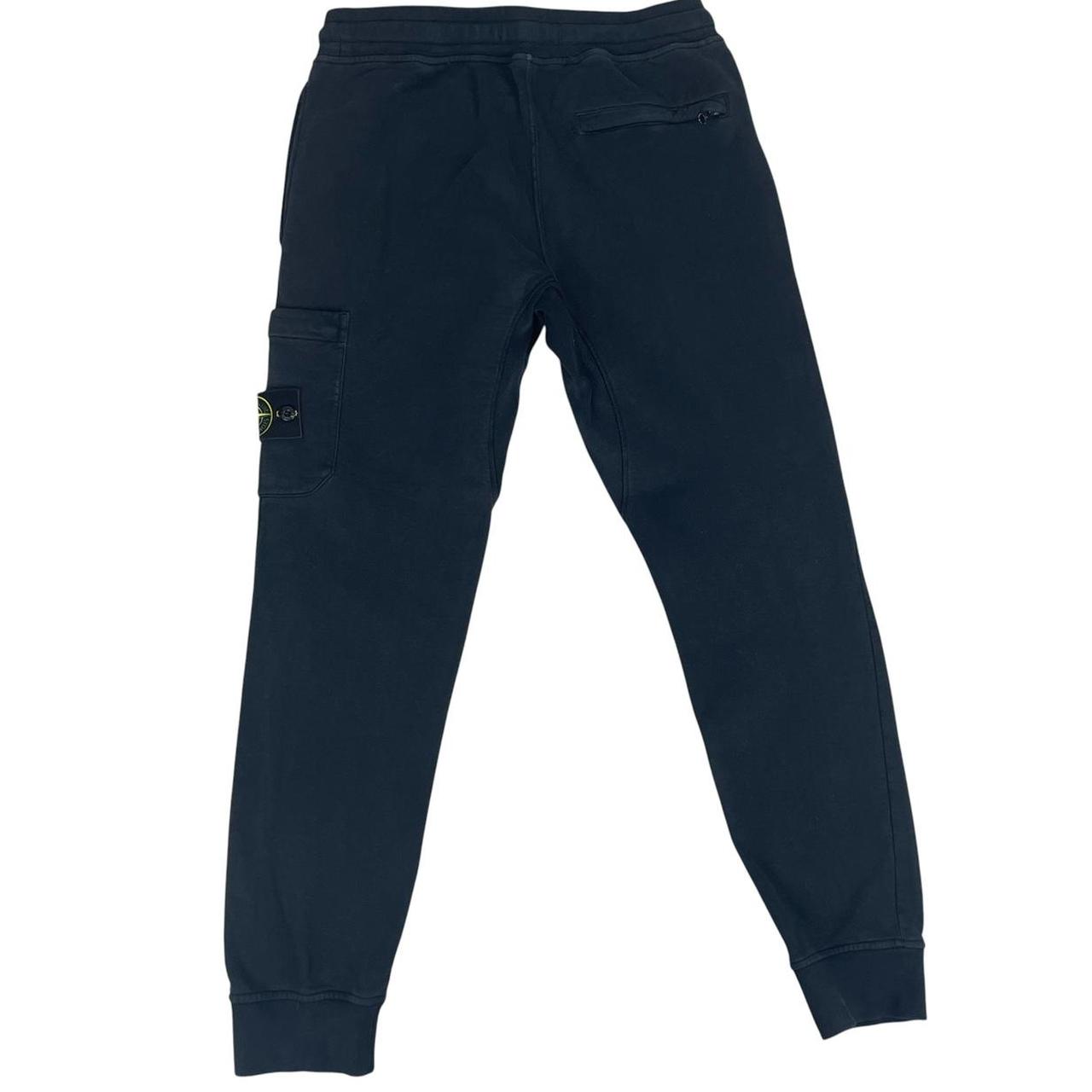 Stone Island navy blue joggers with logo patch and cotton material, pre-owned condition.