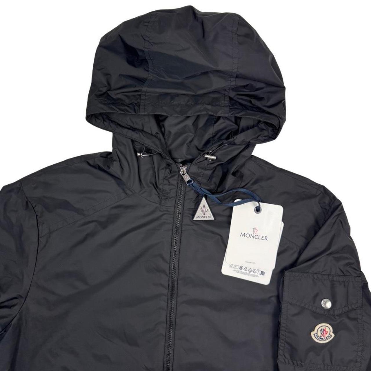Moncler black windbreaker jacket, full zip, hooded, nylon material, logo on chest.
