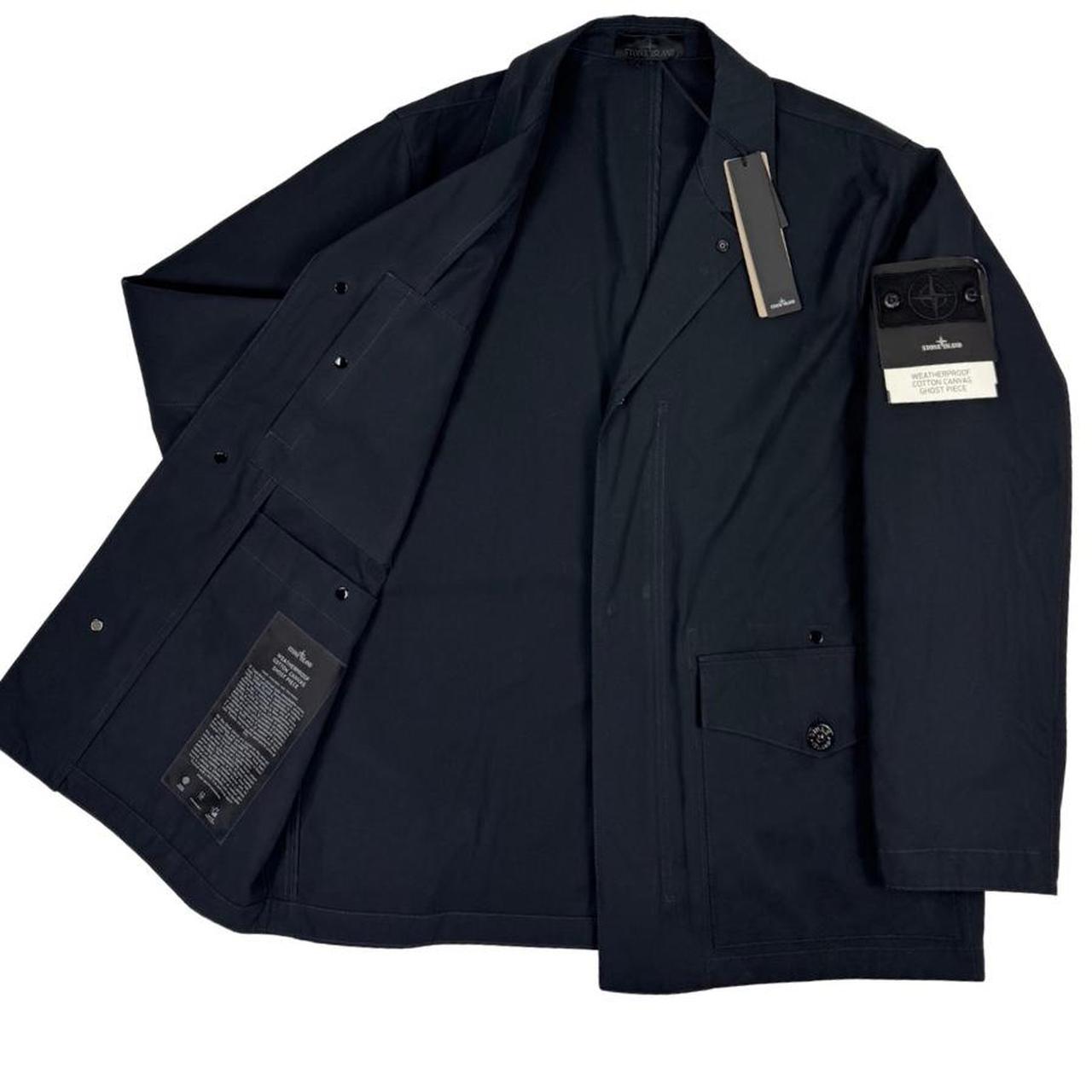 Stone Island navy blue jacket weatherproof cotton canvas with ghost logo detail.