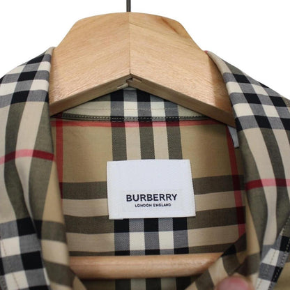 Burberry tan brown long sleeve shirt with Nova Check pattern and logo detail.