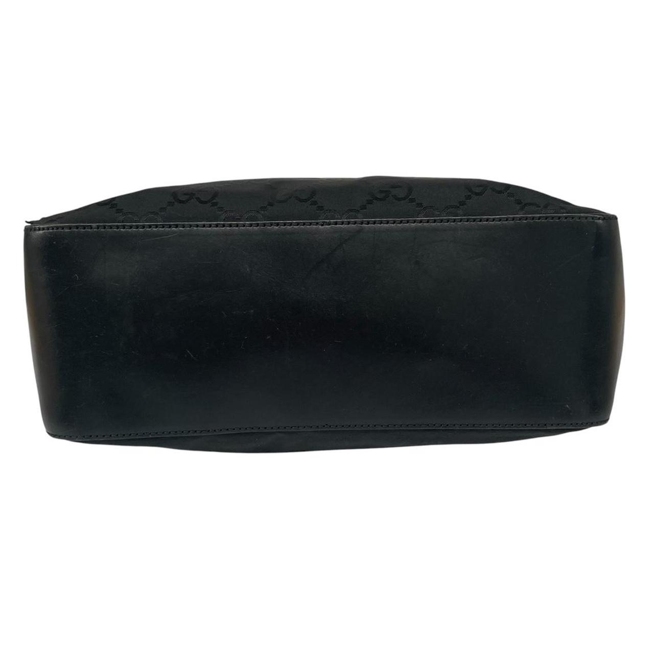 Gucci black hobo shoulder bag with monogram canvas and leather detailing.