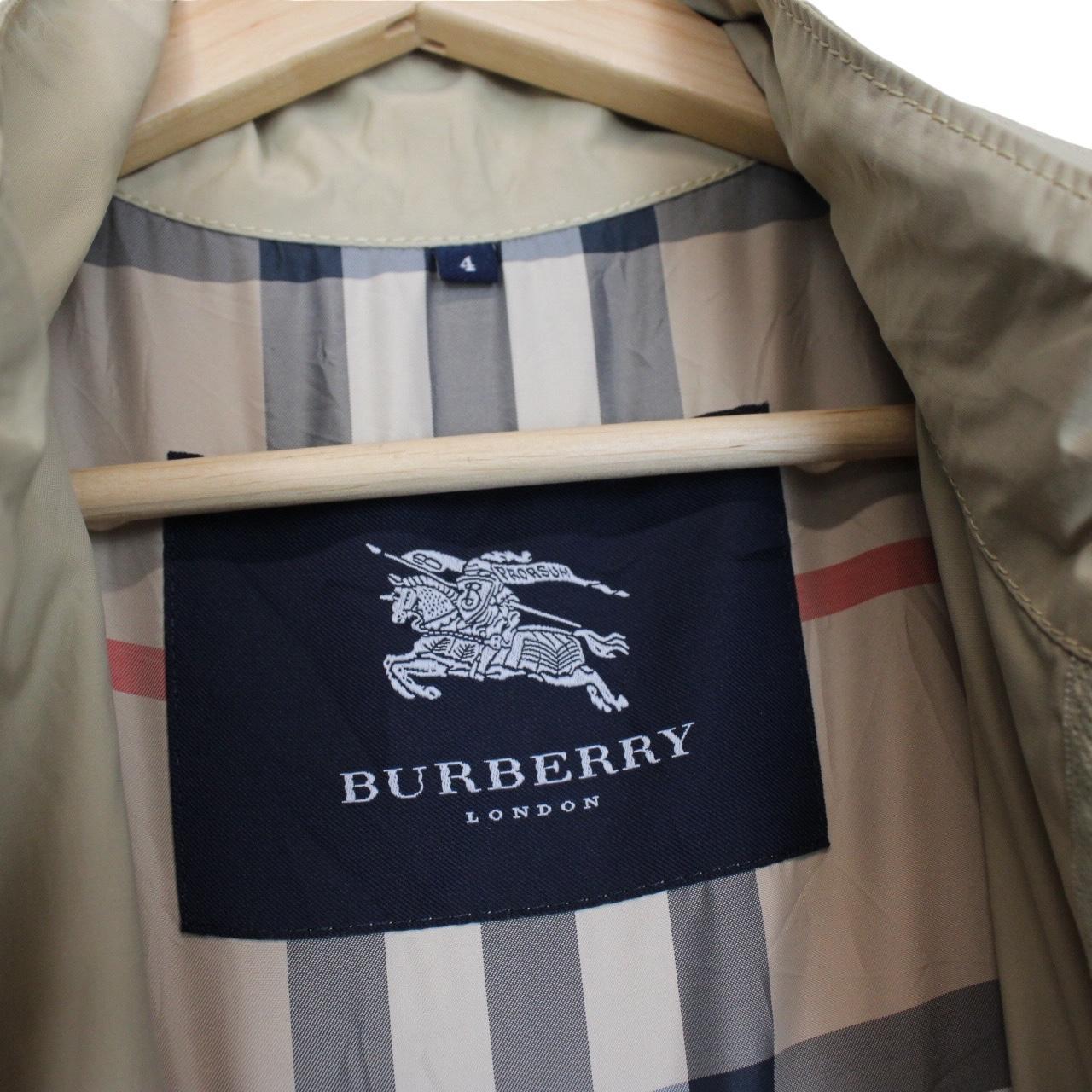 Burberry beige windbreaker jacket with full zip, logo detail, and nylon material.