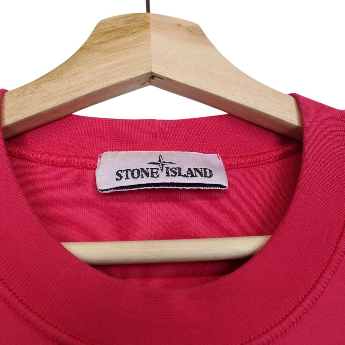 Stone Island pink sweatshirt cotton fabric with iconic compass logo on sleeve.