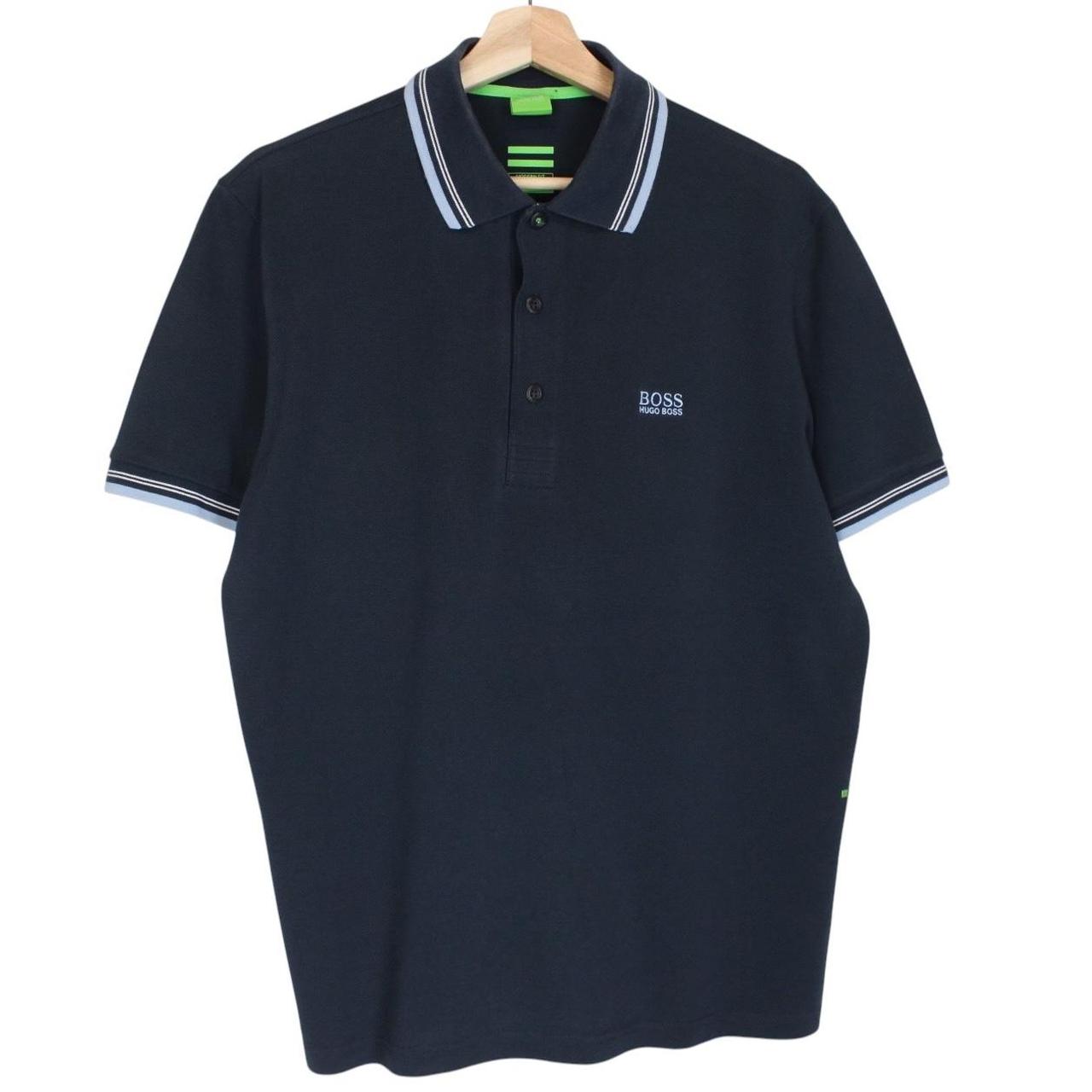 Hugo Boss navy blue short sleeve polo shirt with embroidered logo and cotton material.
