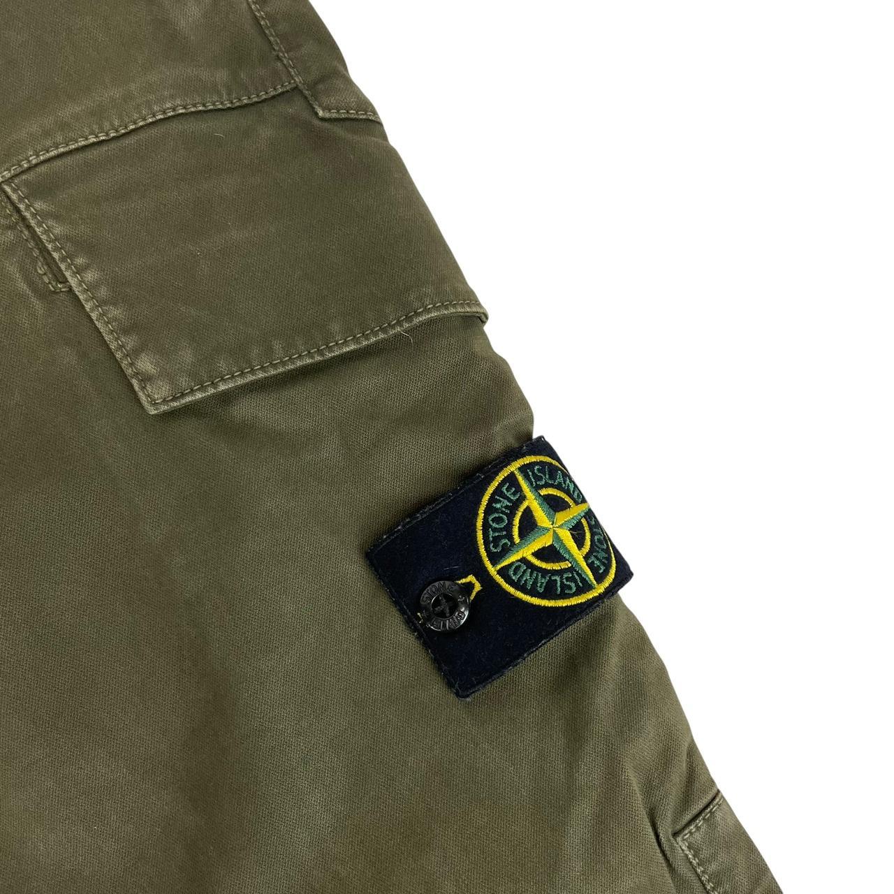 Stone Island khaki green skinny fit cargo trousers with logo patch and pockets.