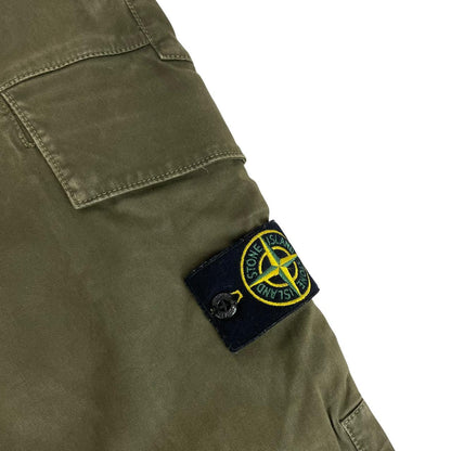 Stone Island khaki green skinny fit cargo trousers with logo patch and pockets.