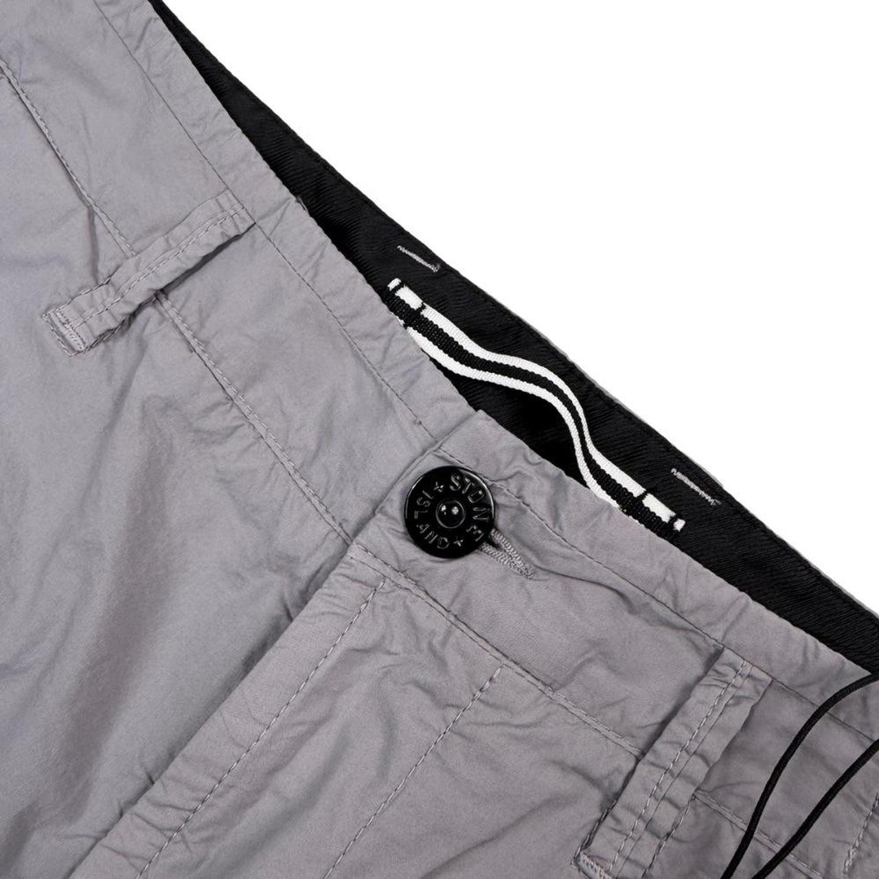 Stone Island grey cargo shorts with logo patch and multiple pockets in cotton material.