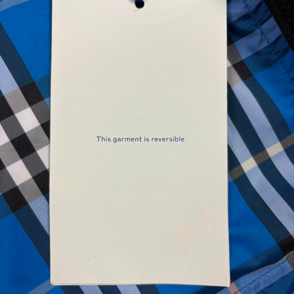Burberry reversible windbreaker jacket in blue and black with Nova Check pattern.