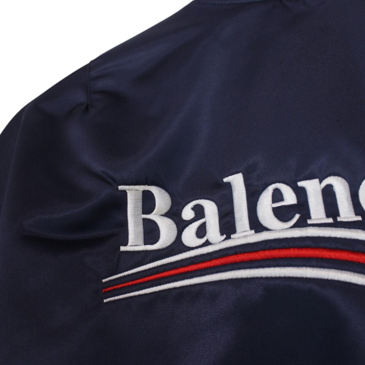 Balenciaga navy bomber jacket with full zip and campaign logo on chest.
