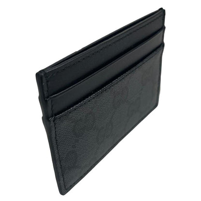 Gucci black card holder featuring Supreme GG monogram pattern in leather and canvas.