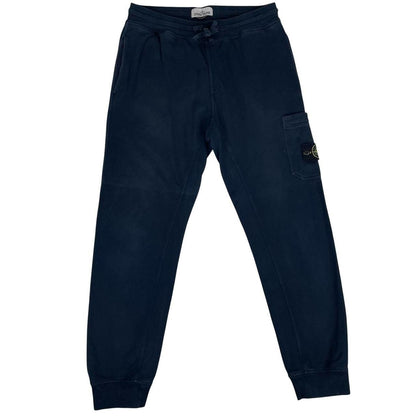 Stone Island navy blue joggers with logo patch and cotton material.