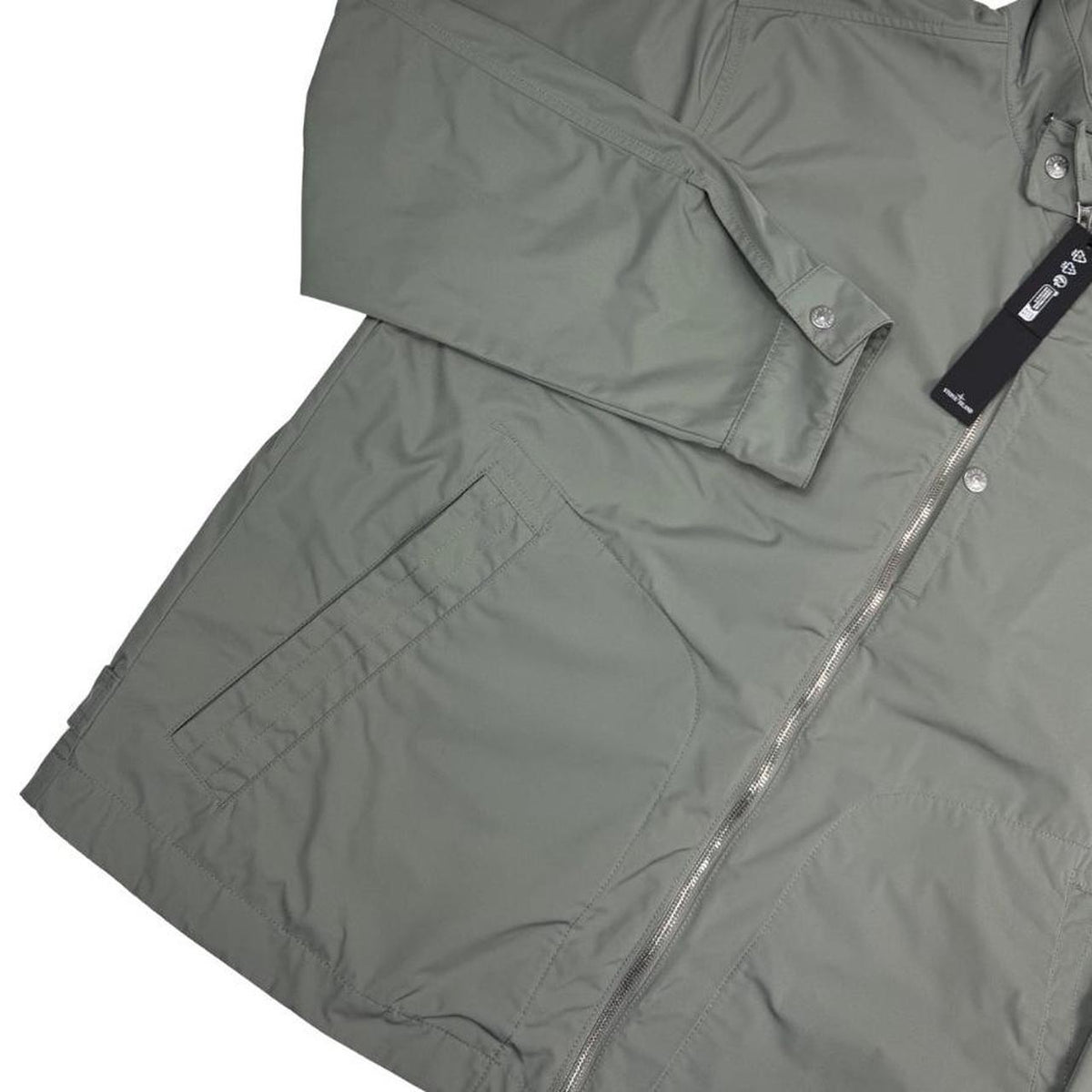 Stone Island green full zip jacket with logo patch and micro twill fabric.