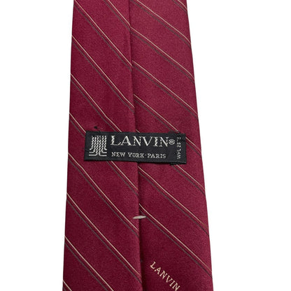 Lanvin burgundy silk tie with logo print and smooth texture.