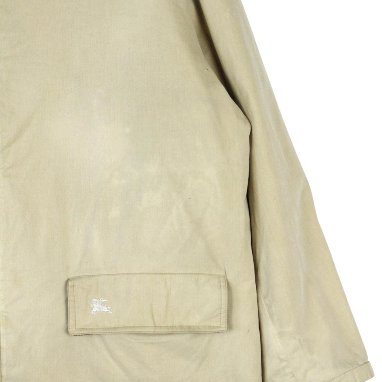 Burberry beige wool coat with Nova Check lining and logo detailing.