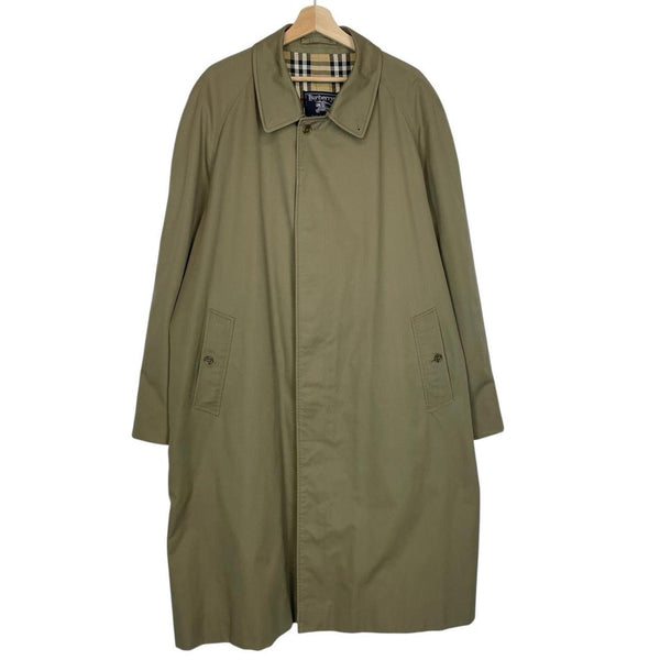 Burberry khaki green trench coat featuring classic Nova Check pattern and single breasted design.