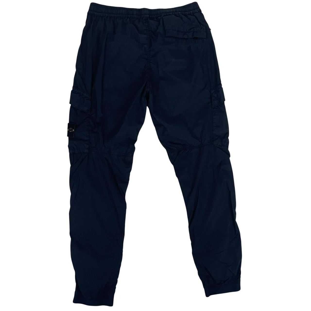 Stone Island navy blue cargo trousers with logo patch and RE-T fit design.
