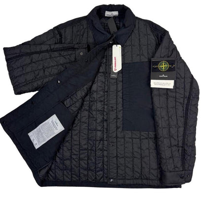 Stone Island black quilted nylon jacket with logo badge and Primaloft-TC material.