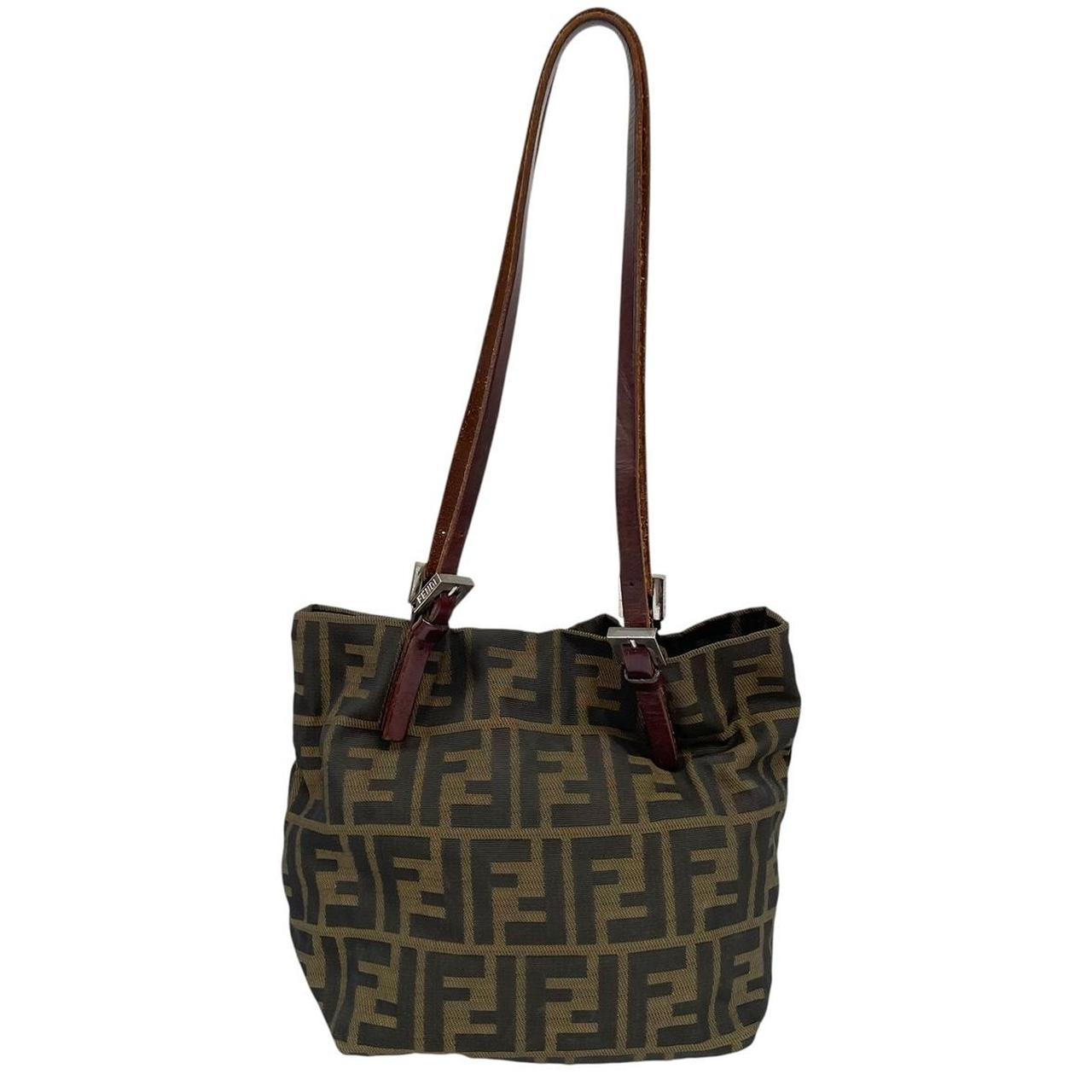 Fendi brown duffel bag featuring iconic Zucca monogram canvas and durable handles.