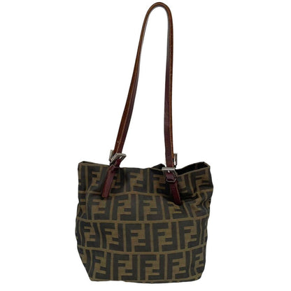 Fendi brown duffel bag featuring iconic Zucca monogram canvas and durable handles.