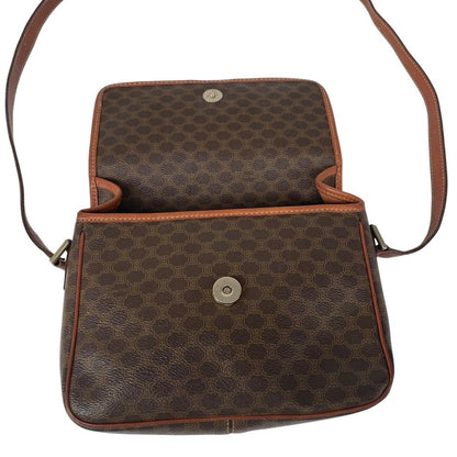CELINE brown duffel bag with Macadam canvas pattern and logo detail.