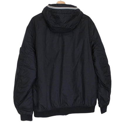 Stone Island black jacket with crinkle texture and logo patch on sleeve.