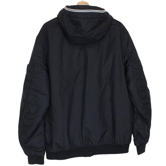 Stone Island black jacket with crinkle texture and logo patch on sleeve.