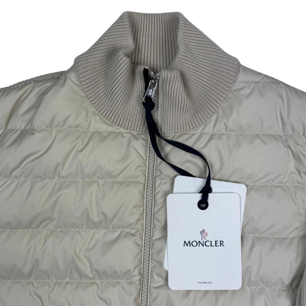 Moncler beige full zip jacket with logo detail and nylon/wool blend material.